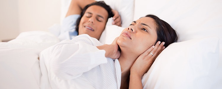 how to make someone stop snoring without waking them up